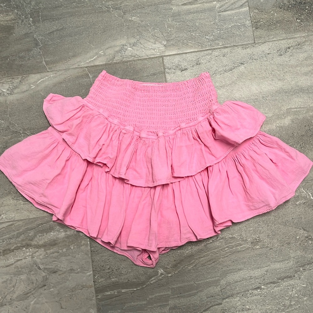 Blanco pink mini skirt with built in shorts. Flowy style with high waisted band.